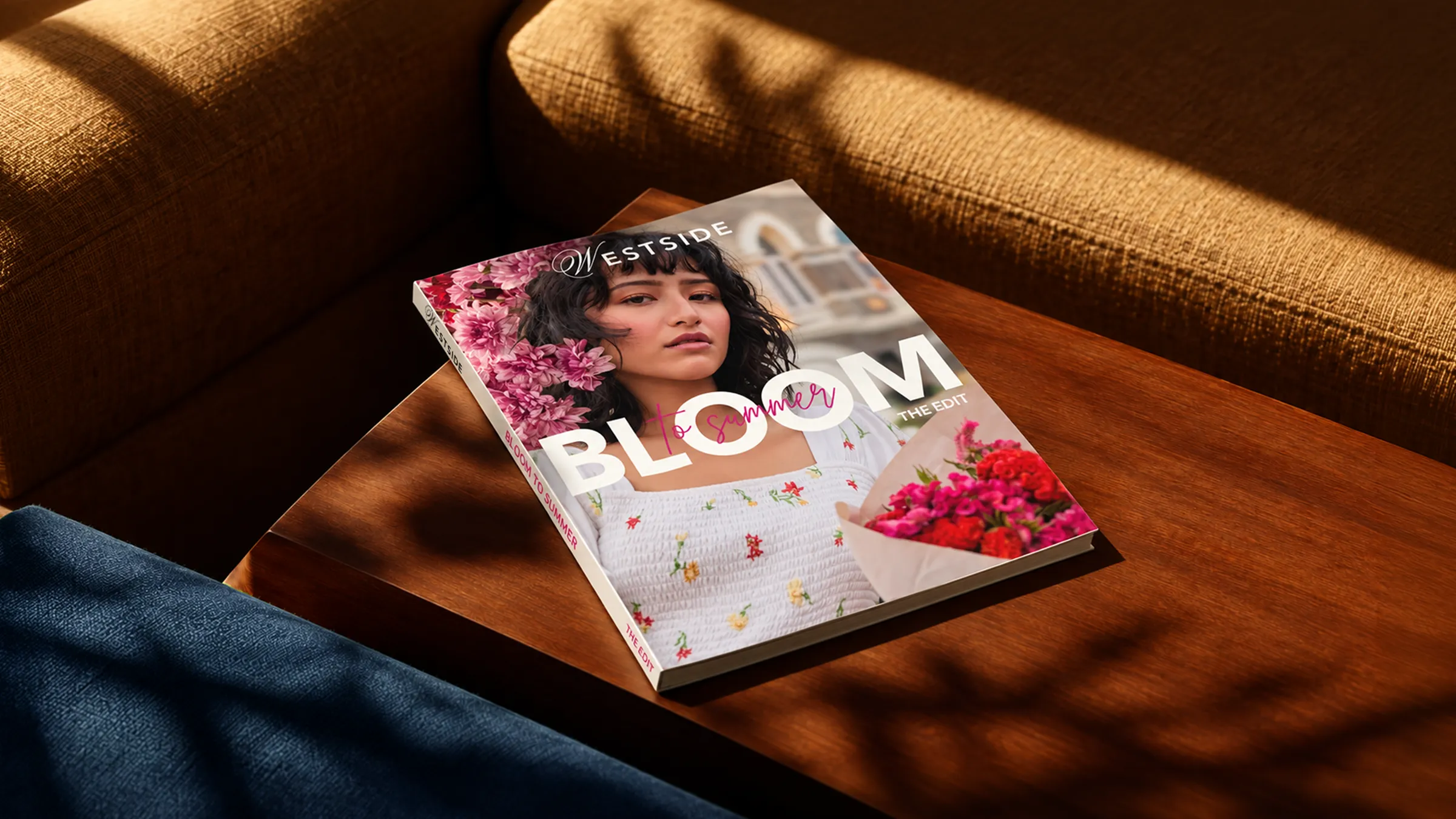 Westside Bloom to Summer magazine on a sunlit table